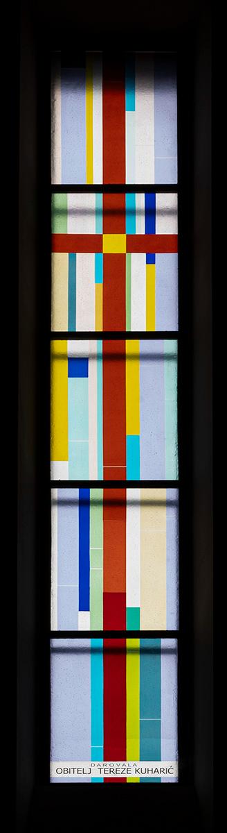 Long narrow window of multicolored glass.